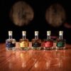 A group of bottles sitting on top of a wooden table.