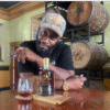 Man smoking Cigar and sipping Rum
